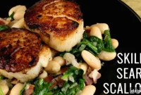 Golden Pan-Seared Scallops with White Beans and Spinach