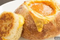 Creamy Goat Cheese Tomato Soup in a Golden Grilled Cheese Bread Bowl