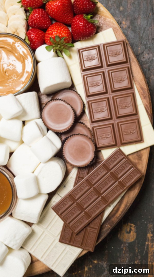 S'mores Creation Station 4 An assortment of various chocolate bars and candies, including milk chocolate, white chocolate, and Reese's Cups, arranged on a s'mores board.