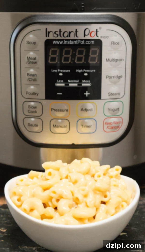 Instant Pot Mac & Cheese in front of the Instant Pot, ready to serve.