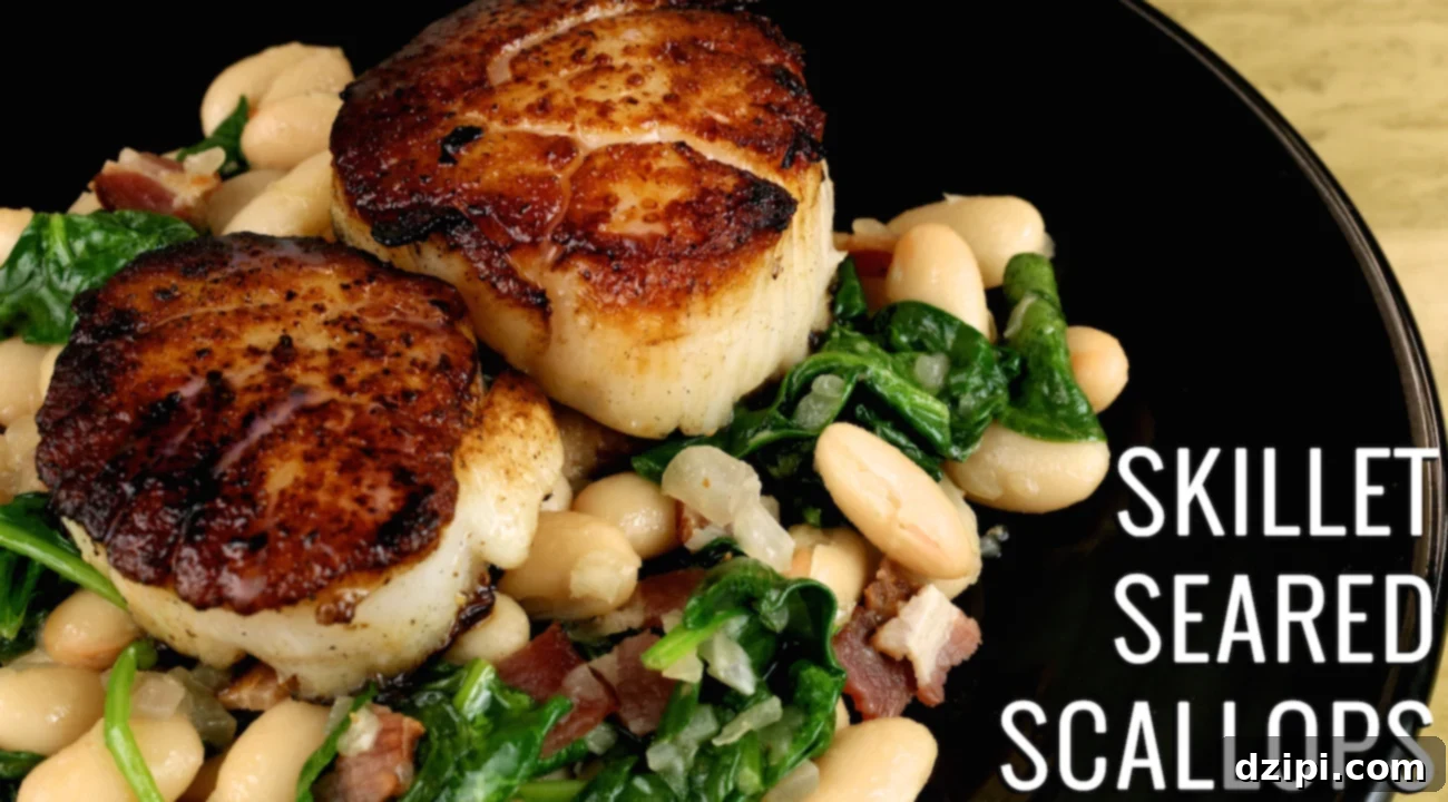 A black dinner plate with two large seared scallops sitting on a bed of white beans, spinach, and bacon, garnished with lemon.