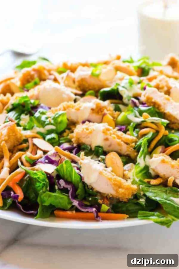 Clone Your Favorite Restaurant Meals At Home 7 Applebees Oriental Chicken Salad in a white bowl on a white background