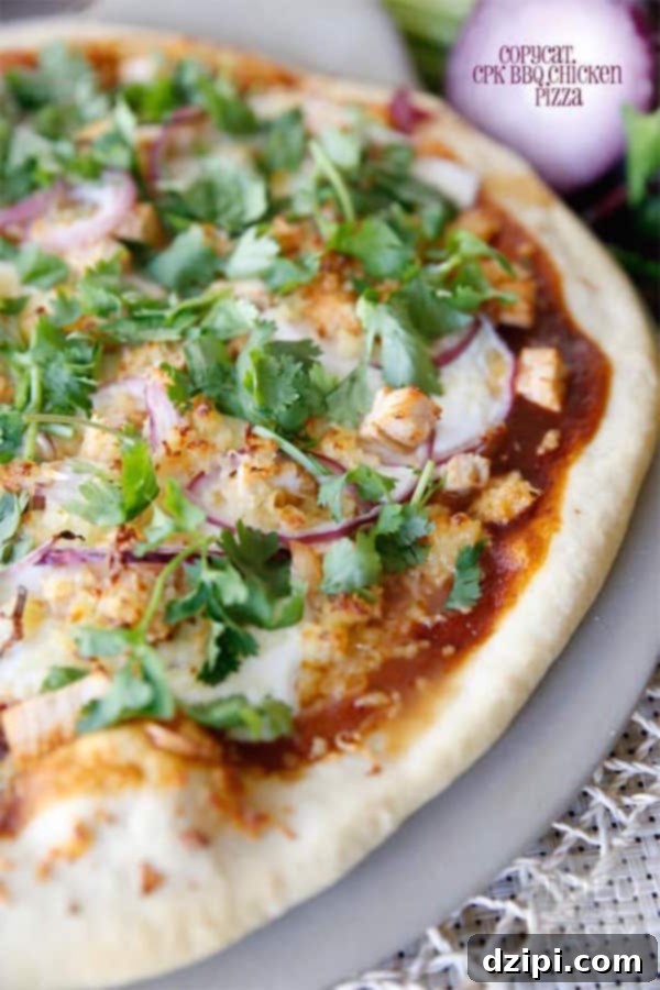 Clone Your Favorite Restaurant Meals At Home 10 Medium shot of half a copycat California Pizza Kitchen BBQ Chicken Pizza