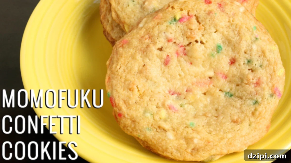 Large confetti cookies with sprinkles baked into the batter on a vibrant yellow plate, ready to be enjoyed. The image evokes a sense of joy and deliciousness.