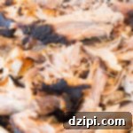 Cherry Cola Smoked Pulled Pork 12 Shredded Cherry Coke Pulled Pork, ready to be served.