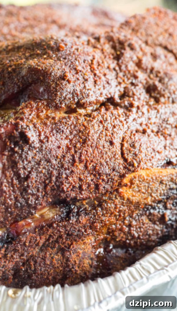 Cherry Cola Smoked Pulled Pork 10 Close up of the glistening, dark bark on a perfectly cooked Cherry Coke pork shoulder.