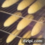 Ember-Kissed Corn on the Cob 5 Three racks of corn inside a smoker, perfect for a smoked corn recipe