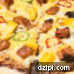 Tropical BBQ Pulled Pork Pizza 5 A whole smoked pork bbq pizza sits on a pizza stone.