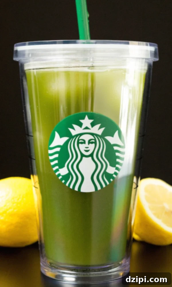 The Secret to Starbucks Matcha Lemonade at Home 2 Homemade Starbucks Matcha Lemonade in a grande cup, perfectly layered and garnished with a lemon slice.