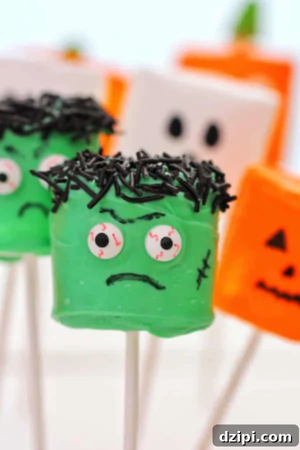 Marshmallows on sticks, artfully decorated to resemble Frankenstein, cheerful jack-o-lanterns, and friendly ghosts for Halloween