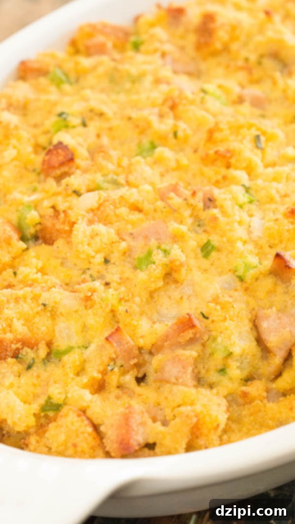 Cornbread stuffing with sausage in a white casserole dish