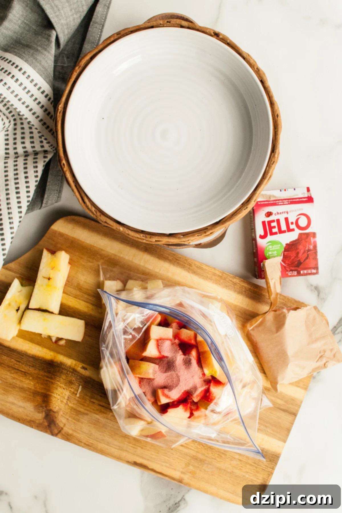 Chopped apple in a ziploc bag have Jello powdered added on top