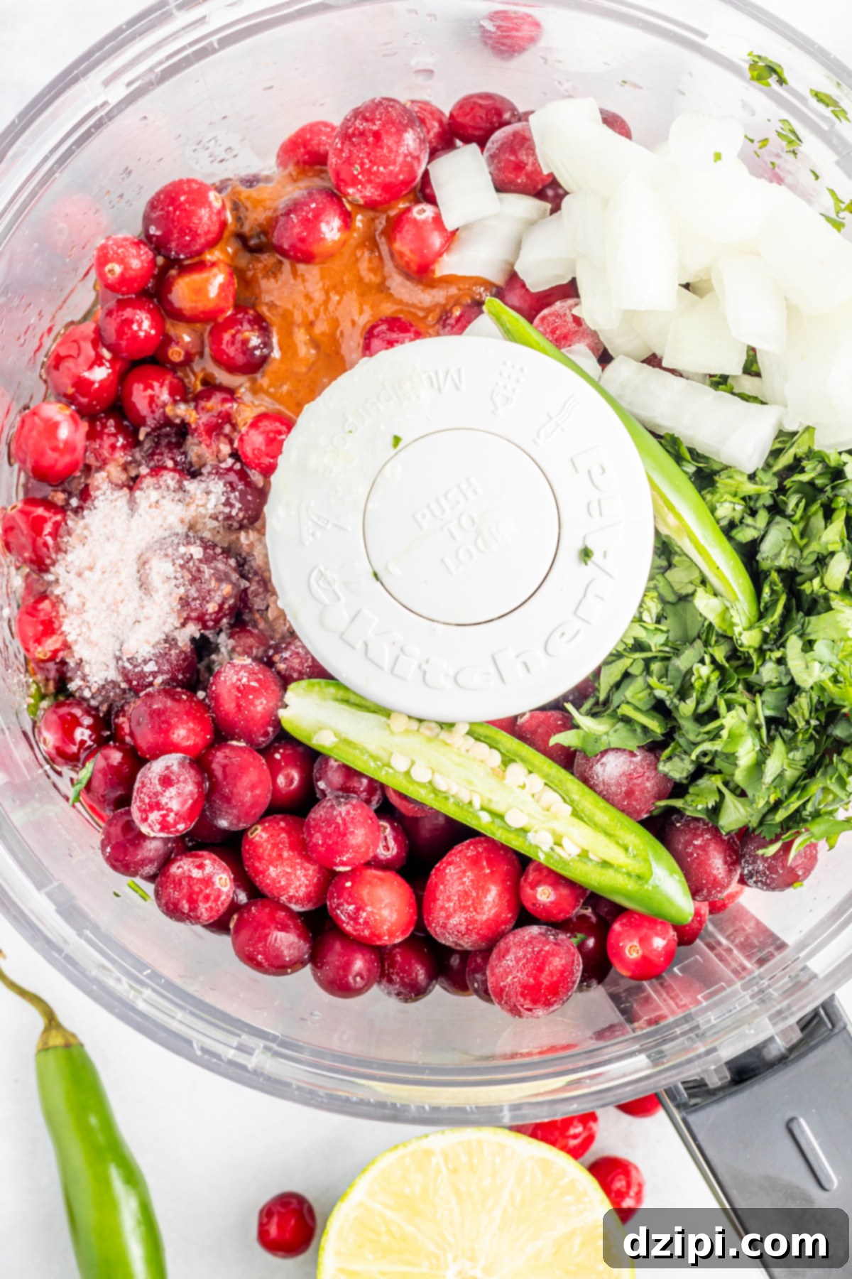 Ruby Red Cranberry Burst 4 Overhead view of cranberry salsa ingredients in a food processor before being pureed.