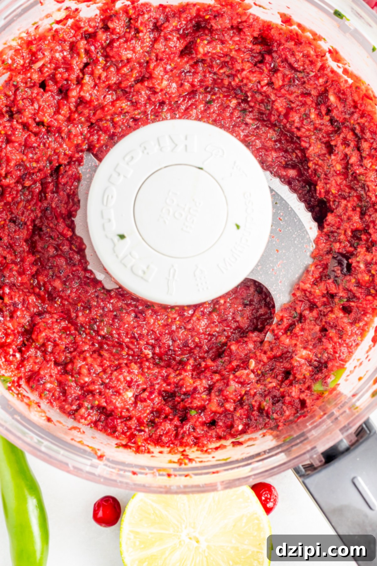 Ruby Red Cranberry Burst 5 Overhead view of a food processor after the cranberry salsa has been pureed.
