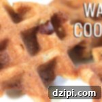 A small pile of freshly made chocolate chip waffle cookies, showcasing their golden-brown color and distinct waffle patterns, on a white background.