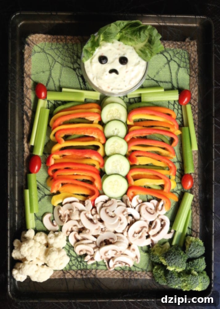 An elaborate skeleton veggie tray arranged with various fresh vegetables, serving as a creative and healthy Halloween party snack.