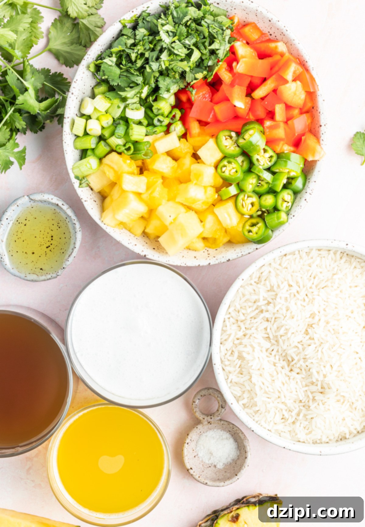Prep bowls filled with all the necessary ingredients to make delicious Instant Pot Coconut Rice, including jasmine rice, coconut milk, pineapple, bell pepper, and jalapeños.