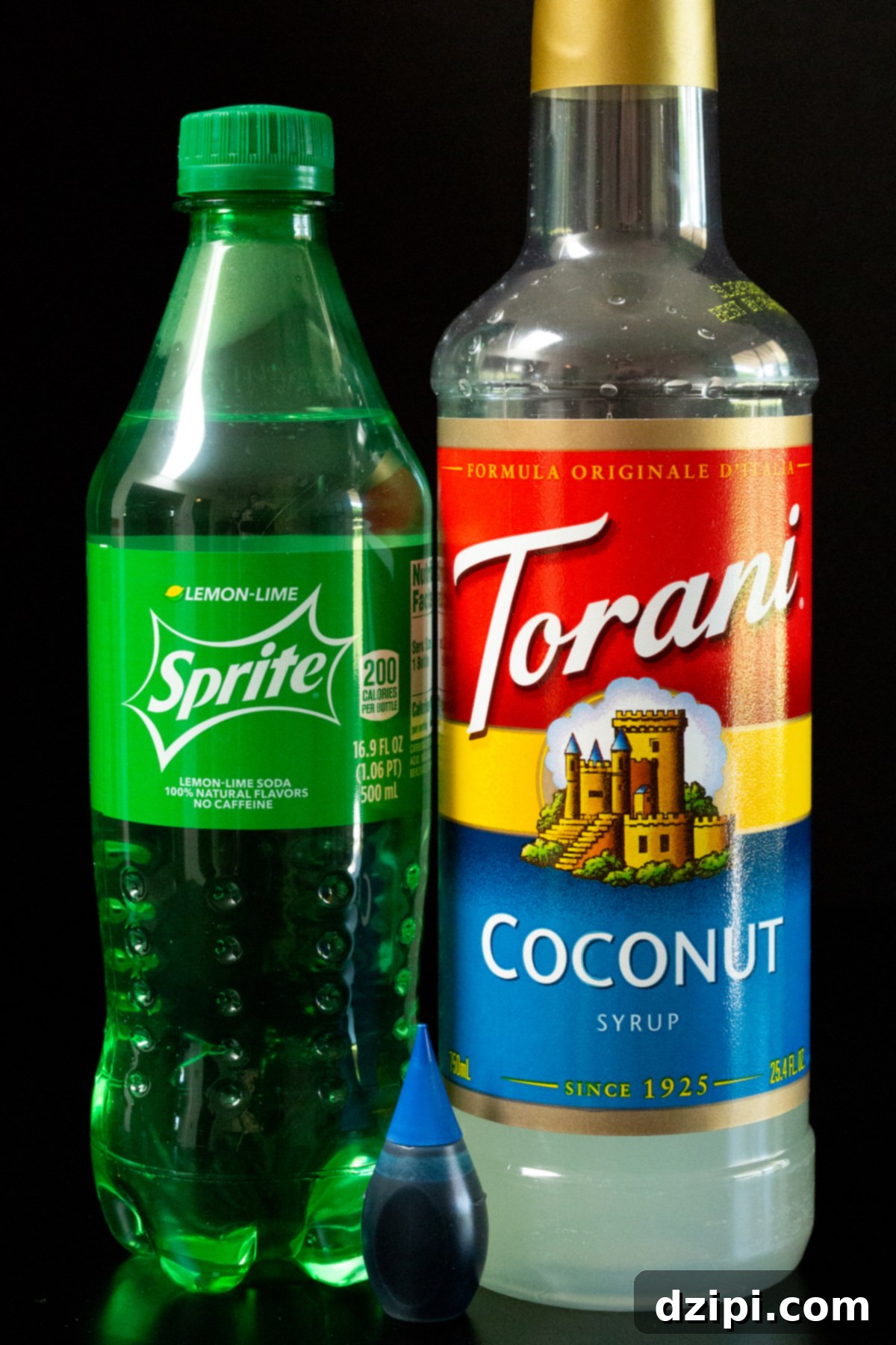The Endless Blue 3 Ingredients for homemade Ocean Water: blue food coloring, lemon-lime soda, coconut syrup, and pebble ice.