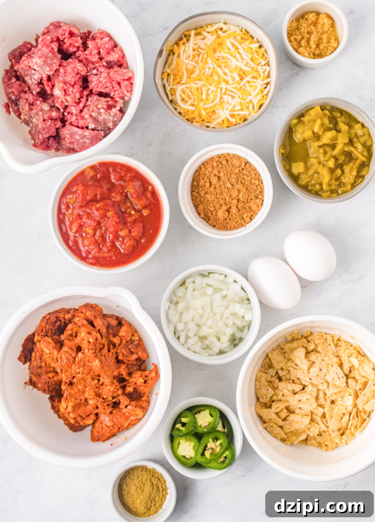 Fiesta Meatloaf 4 Overhead view of Mexican meatloaf ingredients neatly arranged in serving bowls, showcasing the vibrant colors and textures.