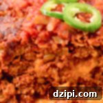 Fiesta Meatloaf 7 Close up of a Mexican Meatloaf that's been sliced to show the cheesy center.