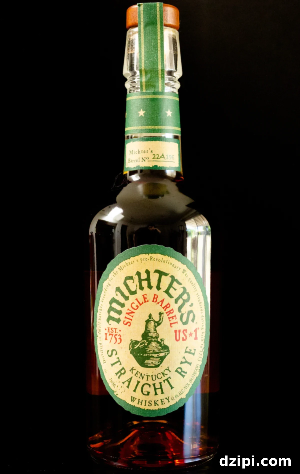 A bottle of Michter's Single Barrel Straight Rye Whiskey on a black background, showcasing its elegant label.