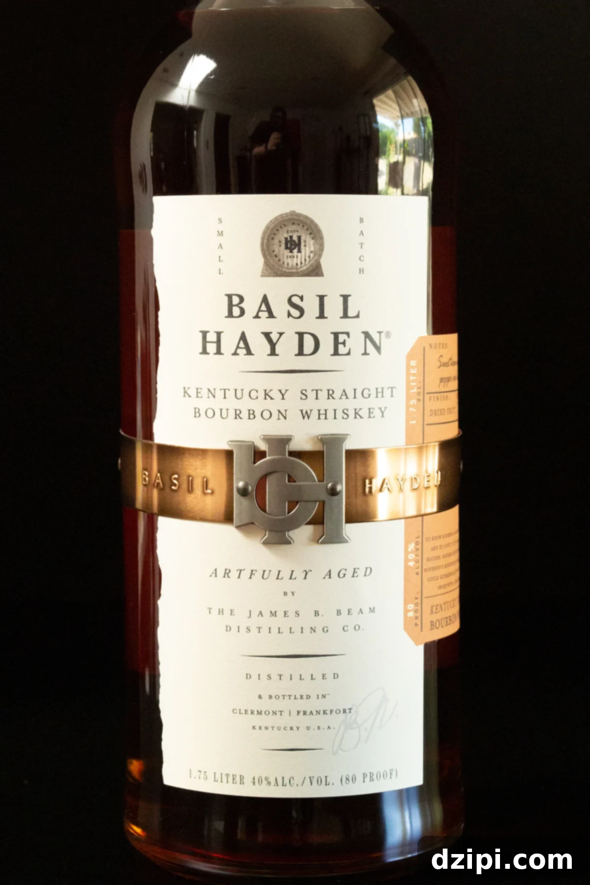 A Basil Hayden whiskey bottle on a black background, exuding an air of sophistication.