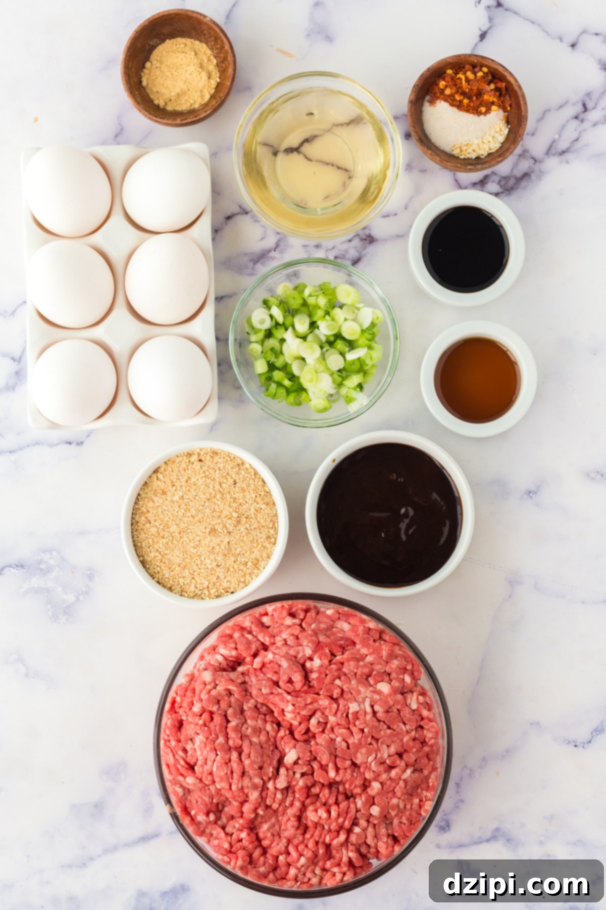 Overhead view of all the ingredient to make Asian Meatballs in prep bowls.