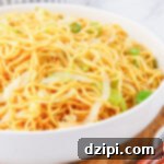 Iconic Panda Express Chow Mein 8 Close up of a white serving bowl filled with homemade Panda Express Chow Mein noodles.