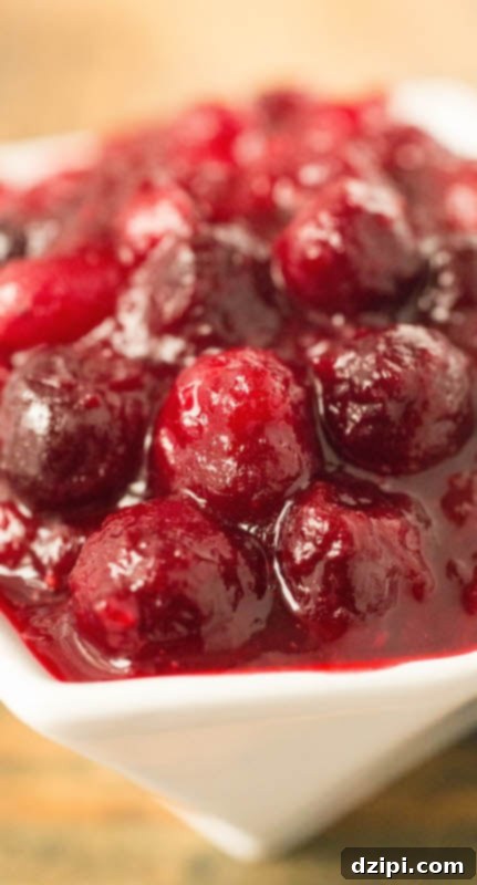 Close-up detailed view of homemade cranberry compote, showcasing its rich texture and natural color.