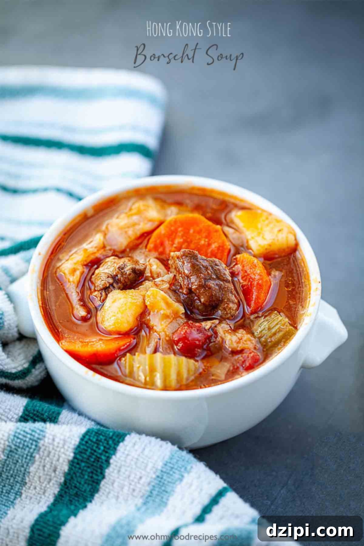 A full bowl of hearty Hong Kong Borscht Soup, showcasing visible chunks of tender meat and roughly chopped vibrant vegetables, hinting at its rich and robust flavor.