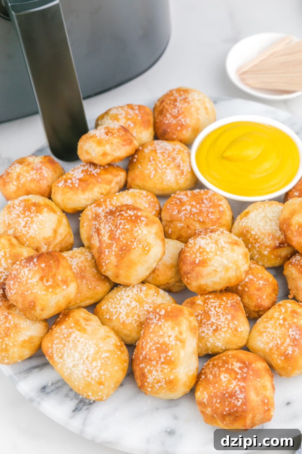 Delicious air fryer pretzel bites piled high, ready for snacking.