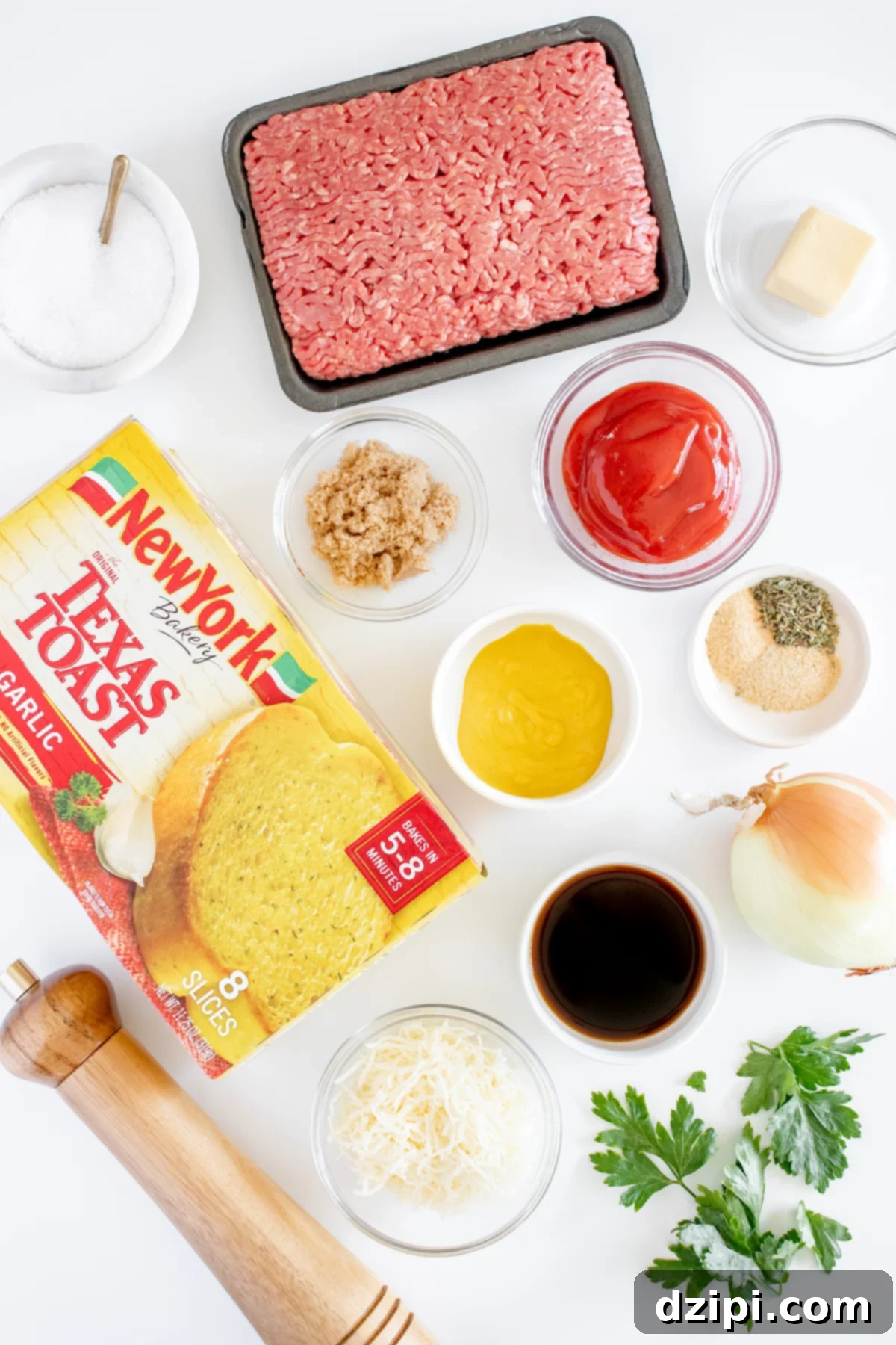 Sloppy Joe Texas Toast Melts 4 All the fresh and pantry ingredients laid out in prep bowls on a white background, including ground beef, diced onion, Texas toast, various seasonings, ketchup, mustard, and cheese.