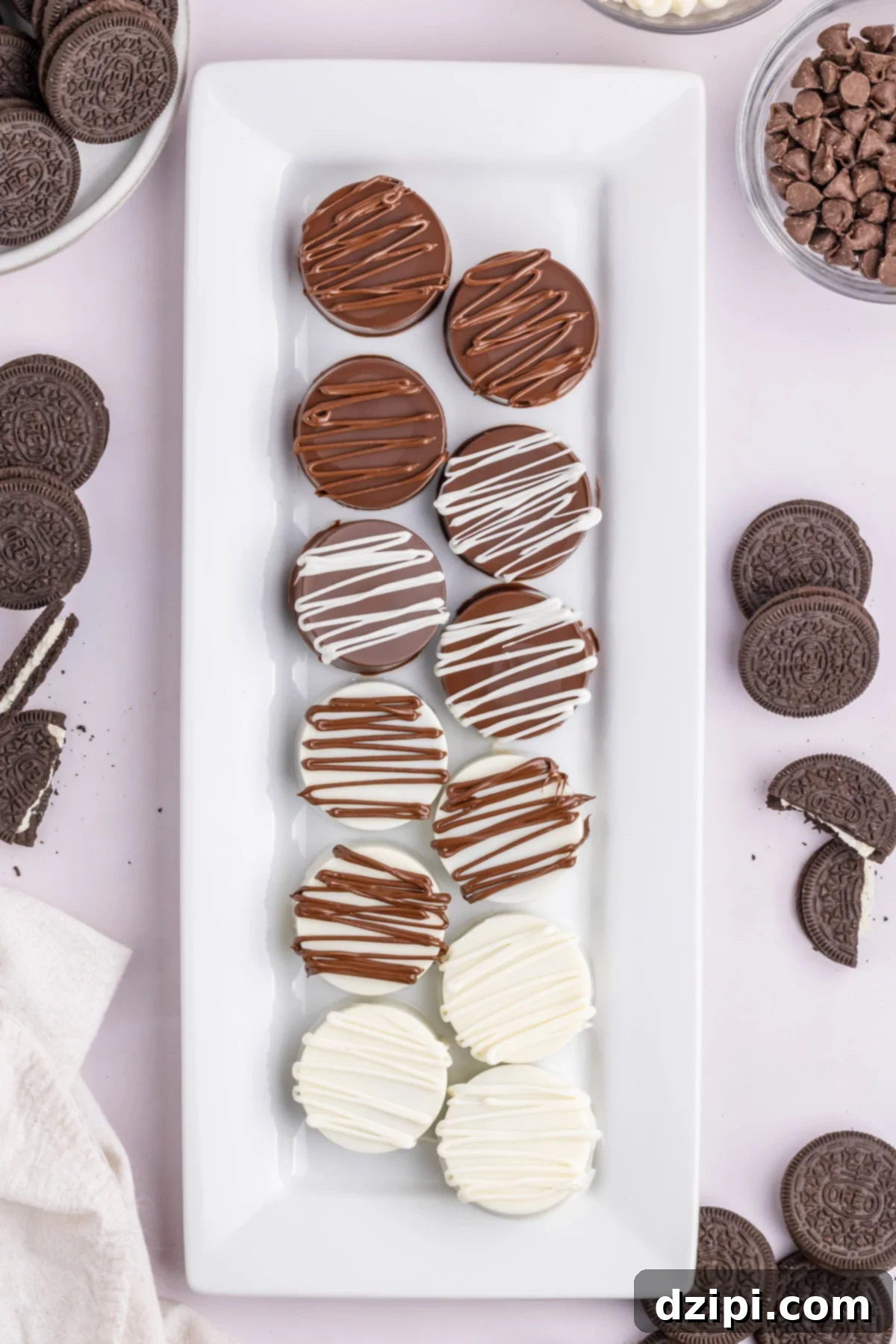 Overhead view of a serving platter filled with white and milk chocolate covered Oreo cookies.