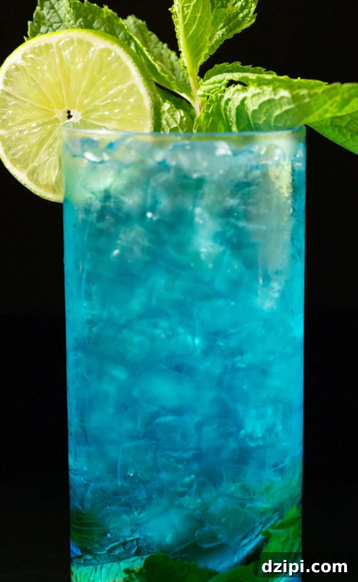 Sapphire Sip 3 Close-up of a blue mojito cocktail in a sleek highball glass, adorned with a bright lime wheel and a fragrant mint sprig, emphasizing its refreshing and exotic appeal.