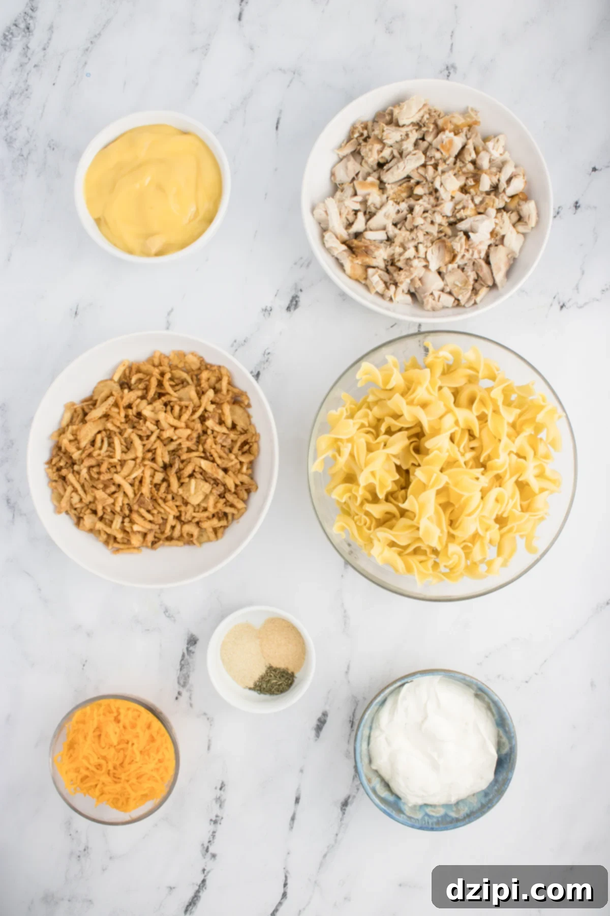 All the ingredients needed to make French Onion Chicken Casserole in prep bowls.