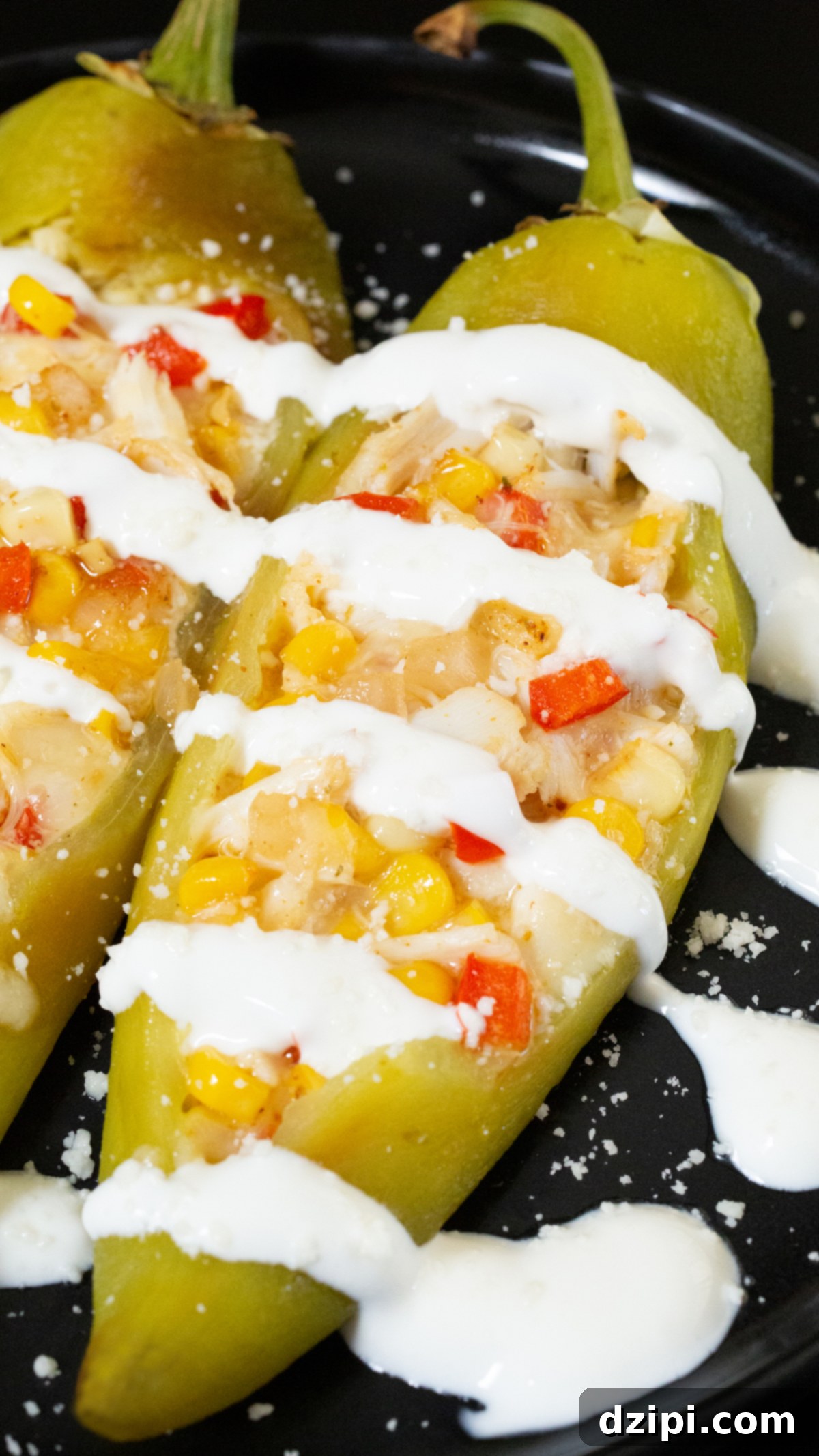 A roasted and peeled hatch pepper that's been stuffed with a mixture of crab, diced red bell pepper, corn and cheese, then generously topped with lime crema and cojita cheese.