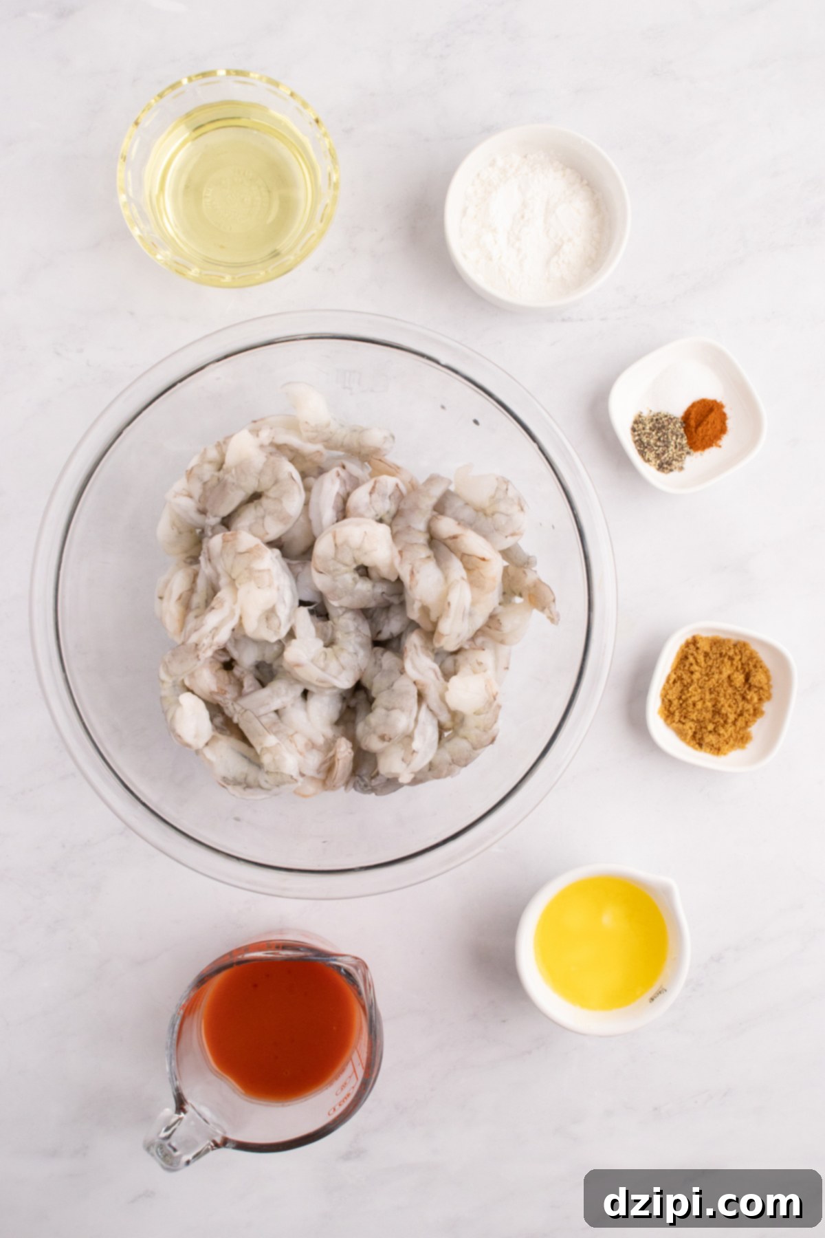 Prep bowls filled with all the ingredients you need to make buffalo shrimp.