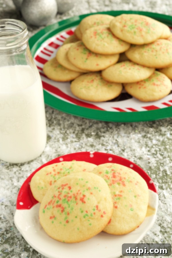 Festive Holiday Sugar Cookies 3 Beautifully decorated Classic Christmas Sugar Cookies adorned with festive red and green sprinkles, ready to be enjoyed