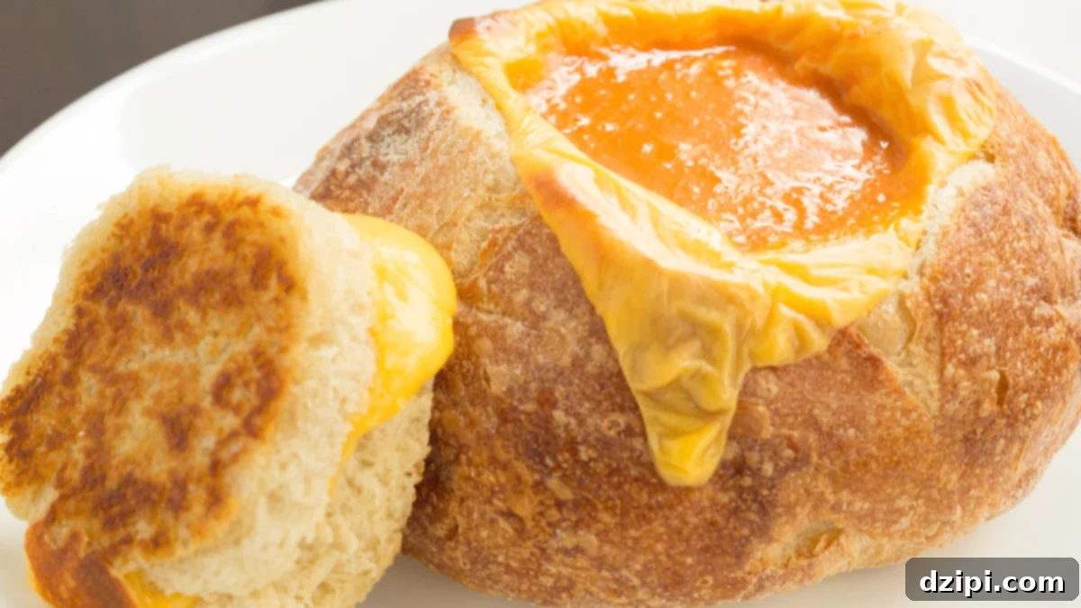 Creamy Goat Cheese Tomato Soup served in a Grilled Cheese Bread Bowl