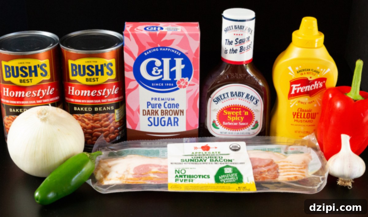 Two cans of baked beans, a white onion, jalapeno, red bell pepper, head of garlic, pack of bacon, brown sugar, bbq sauce, and mustard on a black background.