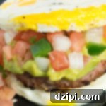 Slow Carb Breakfast Sandwich Recipe: A homemade pork sausage patty sandwiches between two eggs.