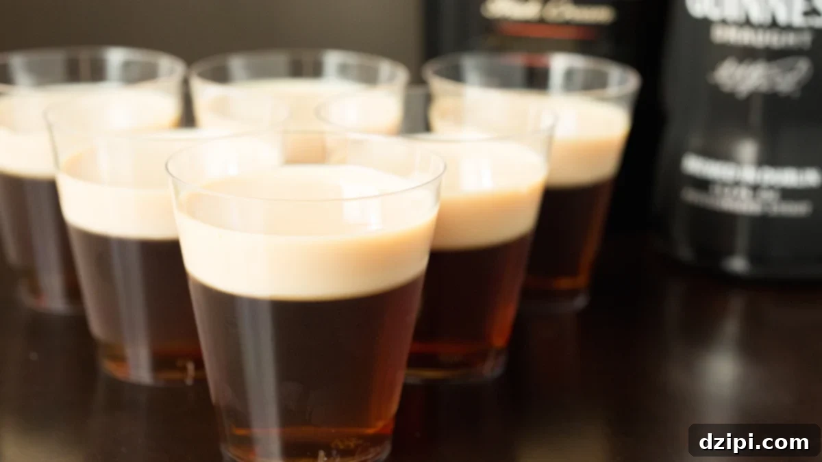 Festive Irish Slammer Jello Shots made with rich Guinness, smooth Irish Whiskey, and creamy Bailey's Irish Cream, perfect for St. Patrick's Day celebrations.