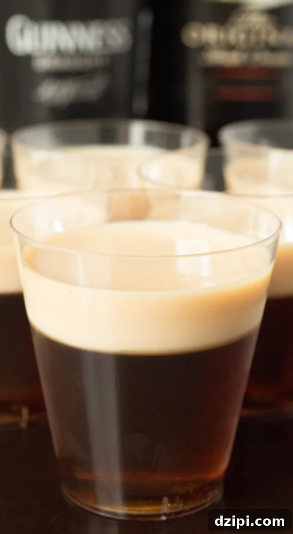 Close-up of elegant Irish Slammer Jello Shots, layered with Guinness, Irish Whiskey, and Bailey's Irish Cream, ready for St. Patrick's Day festivities.