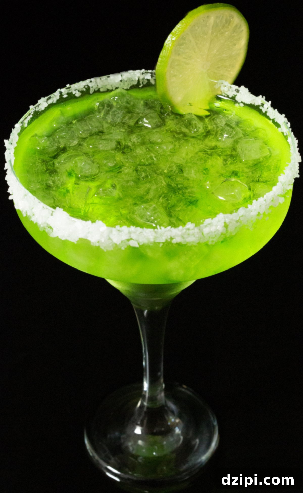 Emerald Melon Margarita 4 A classic tall margarita glass is artfully rimmed with coarse salt, brimming with a vivid neon-green cocktail, and elegantly garnished with a fresh lime wheel, ready to be enjoyed.