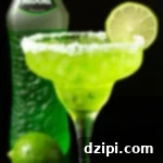 Emerald Melon Margarita 5 A tall margarita glass is rimmed with coarse salt, filled with a bright green margartia, and garnished with a lime wheel. Out of focus in the background is a bottle of Midori and a whole lime.