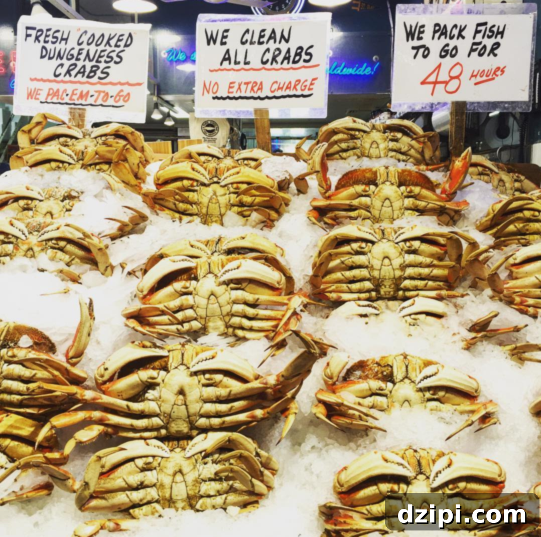 Fresh Dungeness Crabs displayed at a seafood stall in Pike Place Market, Seattle, showcasing the city's rich seafood culture.