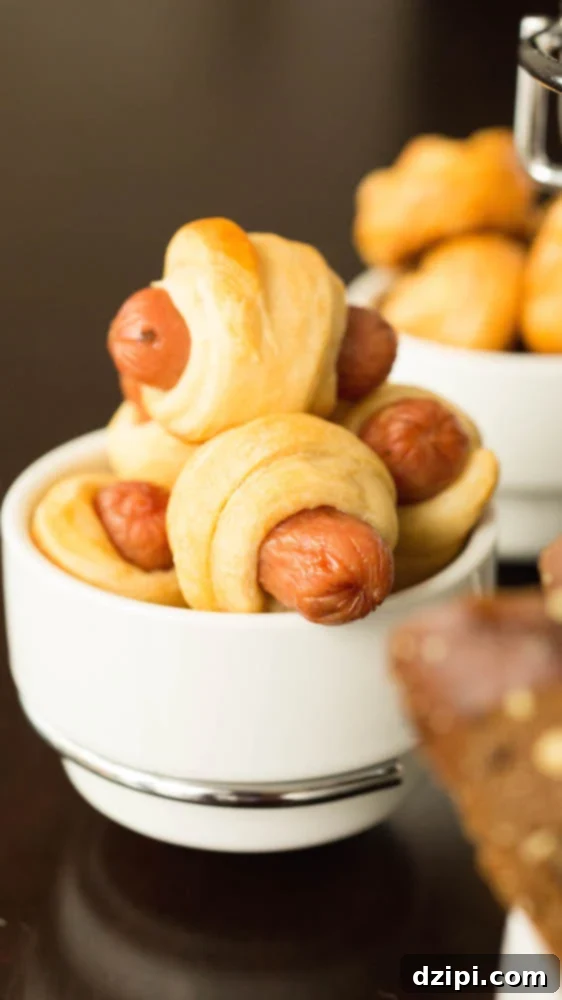 Mini pigs in a blanket ready to be dipped in the beer cheese fondue.