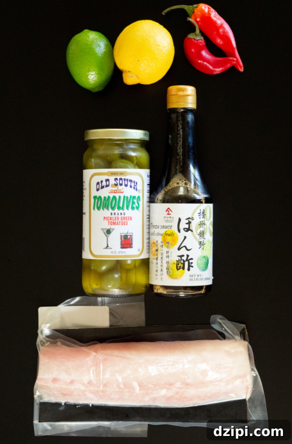 Signature Hamachi Crudo 4 A selection of ingredients for hamachi crudo, including a block of hamachi, fresh citrus, ponzu sauce, and fresno chilies.