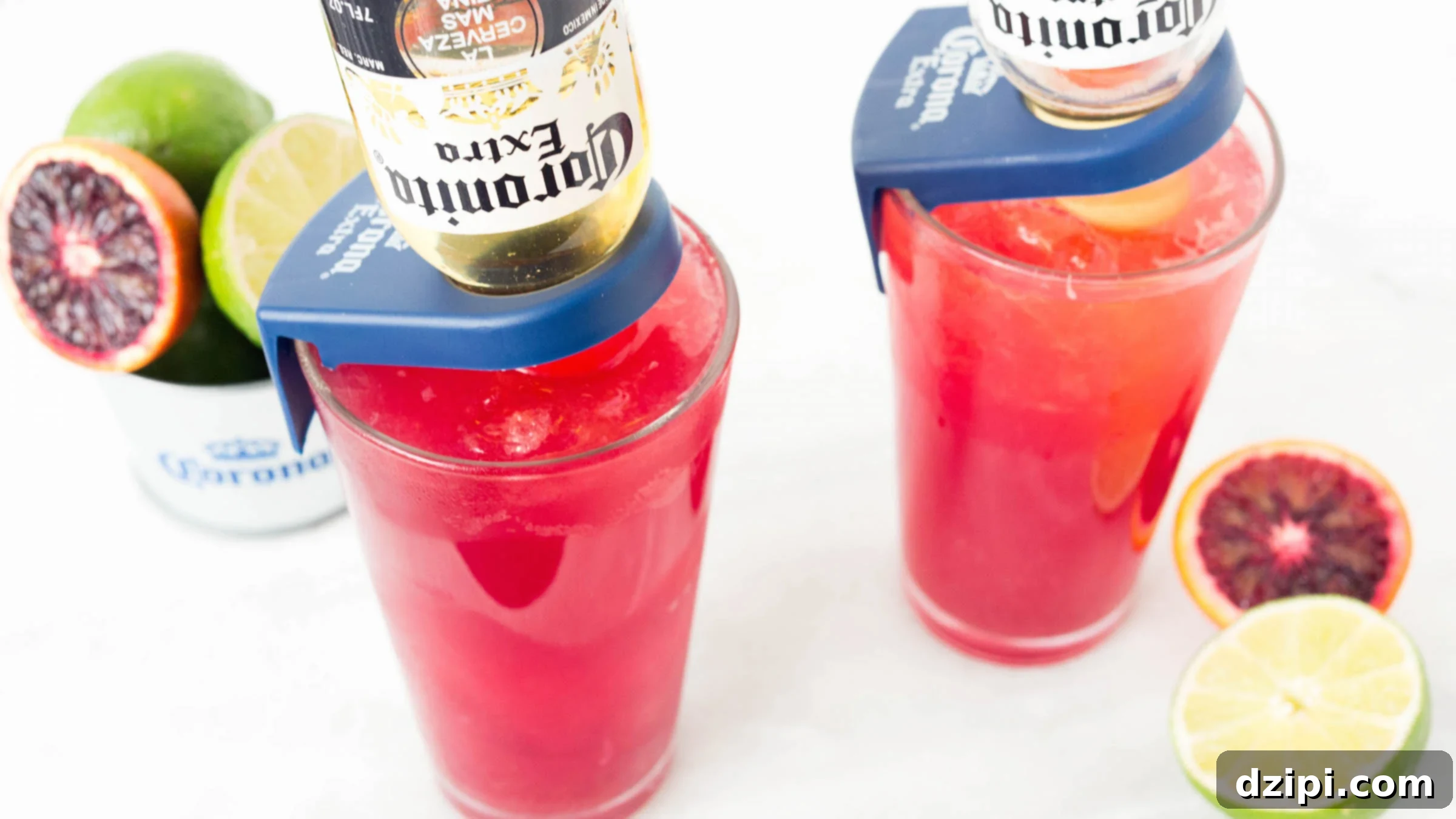 The Perfect Blood Orange Lemongrass CoronaRita 2 A vibrant Blood Orange CoronaRita, adorned with a miniature Corona bottle and fresh blood orange slices, captured against a festive backdrop. The perfect Cinco de Mayo cocktail, featuring zesty blood orange, aromatic lemongrass simple syrup, tequila, and Grand Marnier.