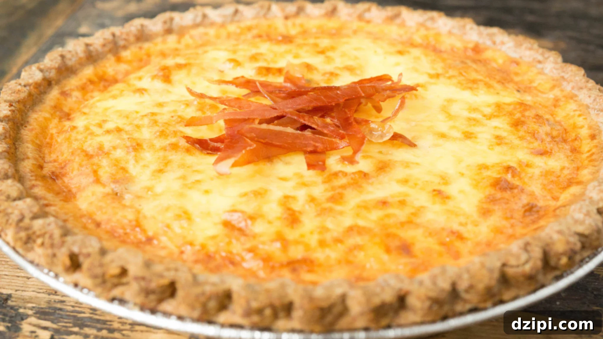 Crispy prosciutto slices on top of a rich Bacon Lover's Duck Egg Quiche.